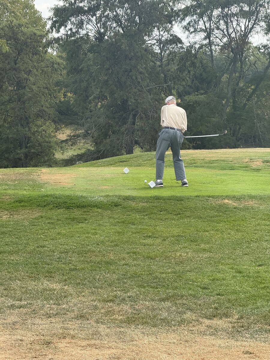 Donzil Hall taking the ceremonial opening tee shot on the fairway
